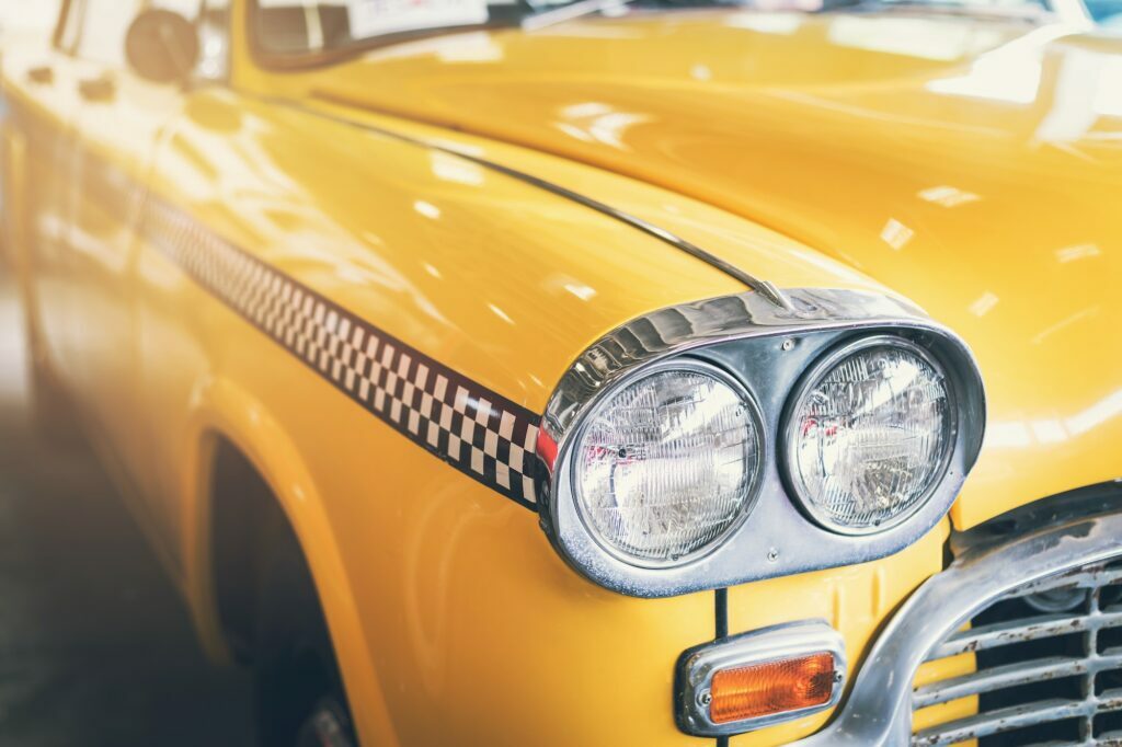 Close up headlight of yellow Retro classic car
